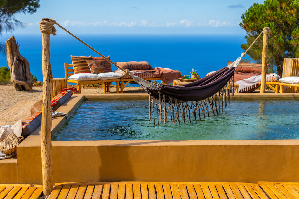Hammock hanging above a pool